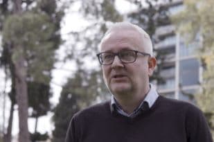 Tony standing outside looking at the camera