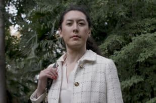 Audrey standing outside with a handbag over her shoulder