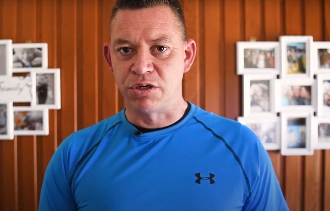 A man in a blue shirt