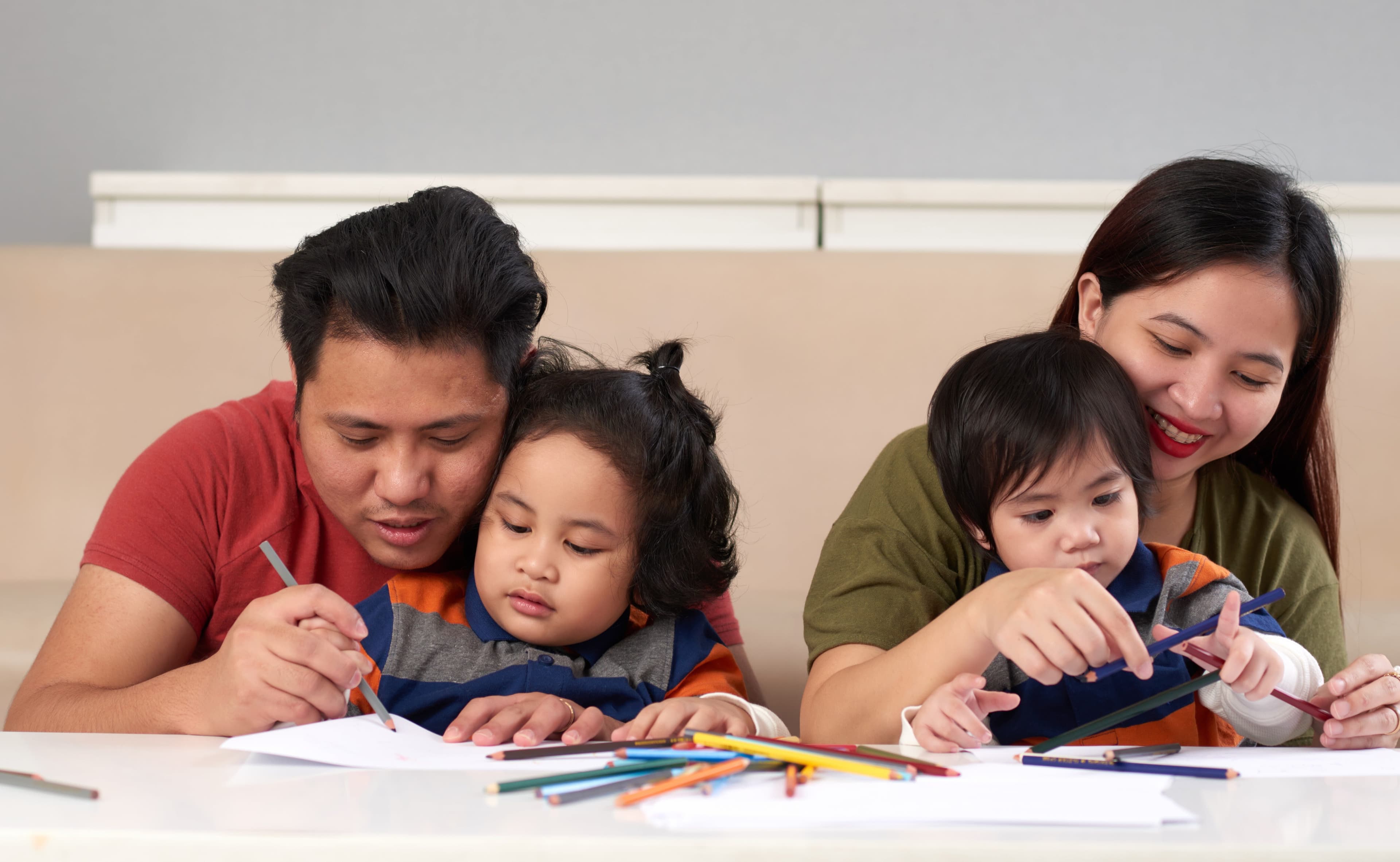  A family help their children with homework
