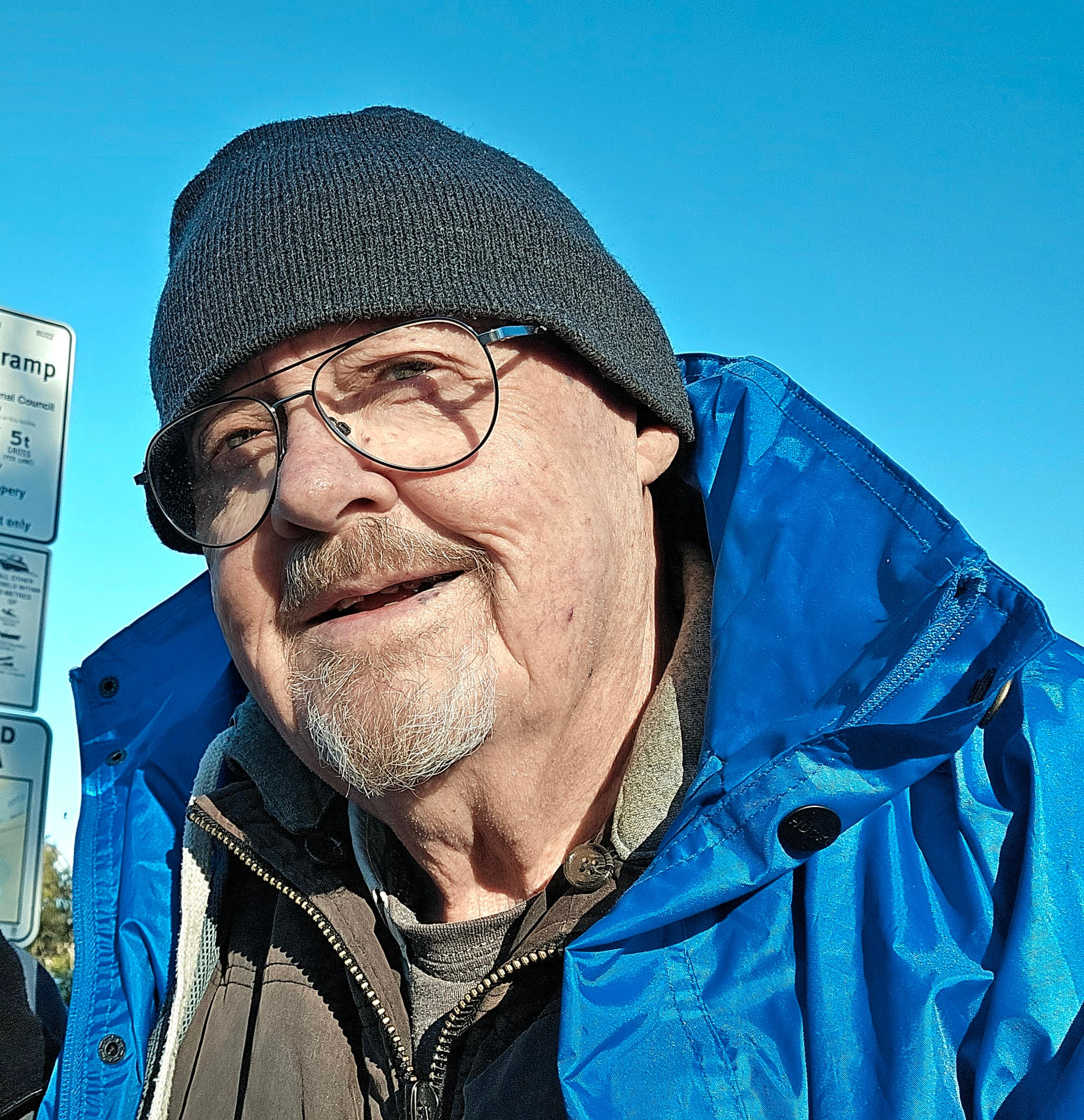 A man in glasses and a beanie