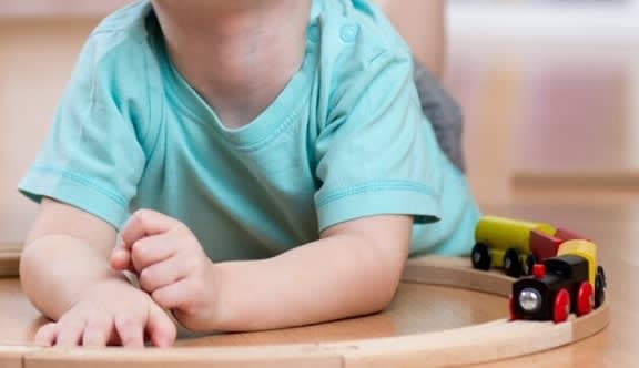 A toddler in a blue shirt