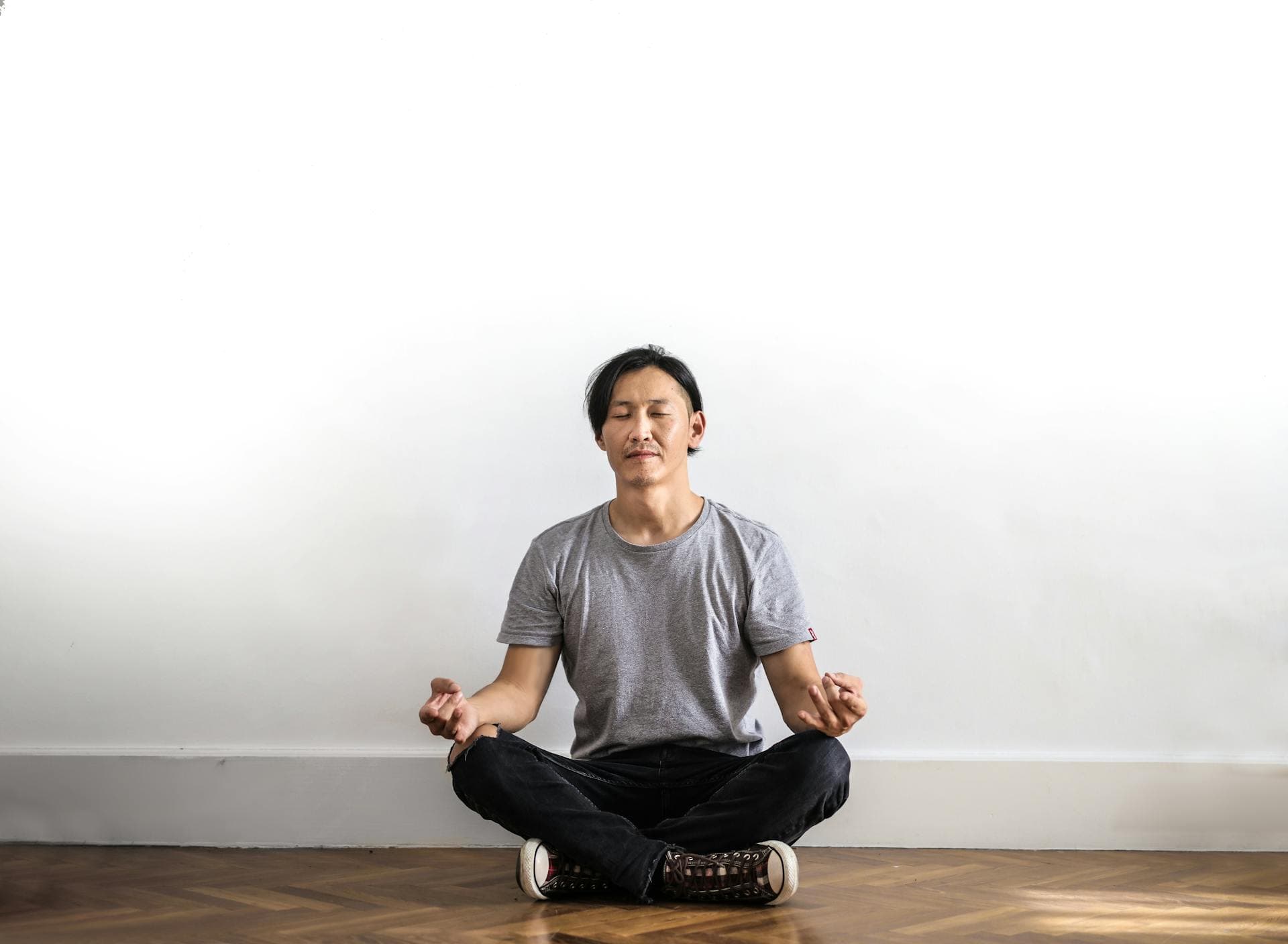 A man sitting down and meditating