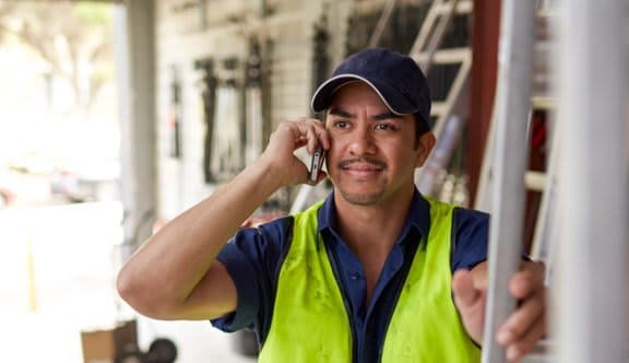 A tradesman on the phone