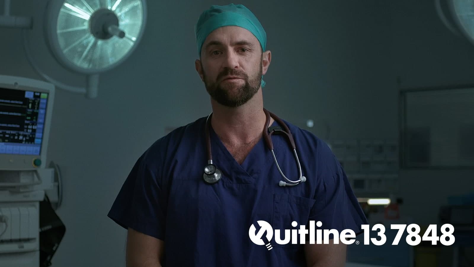 A doctor faces the camera. The Quitline 13 7848 logo and number are in the bottom right hand corner of the frame.