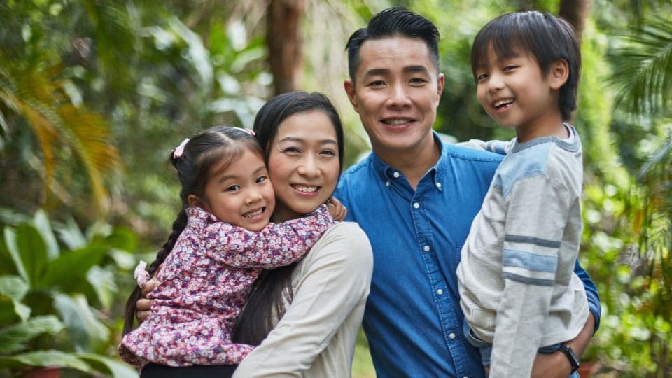 An East Asian family in greenery