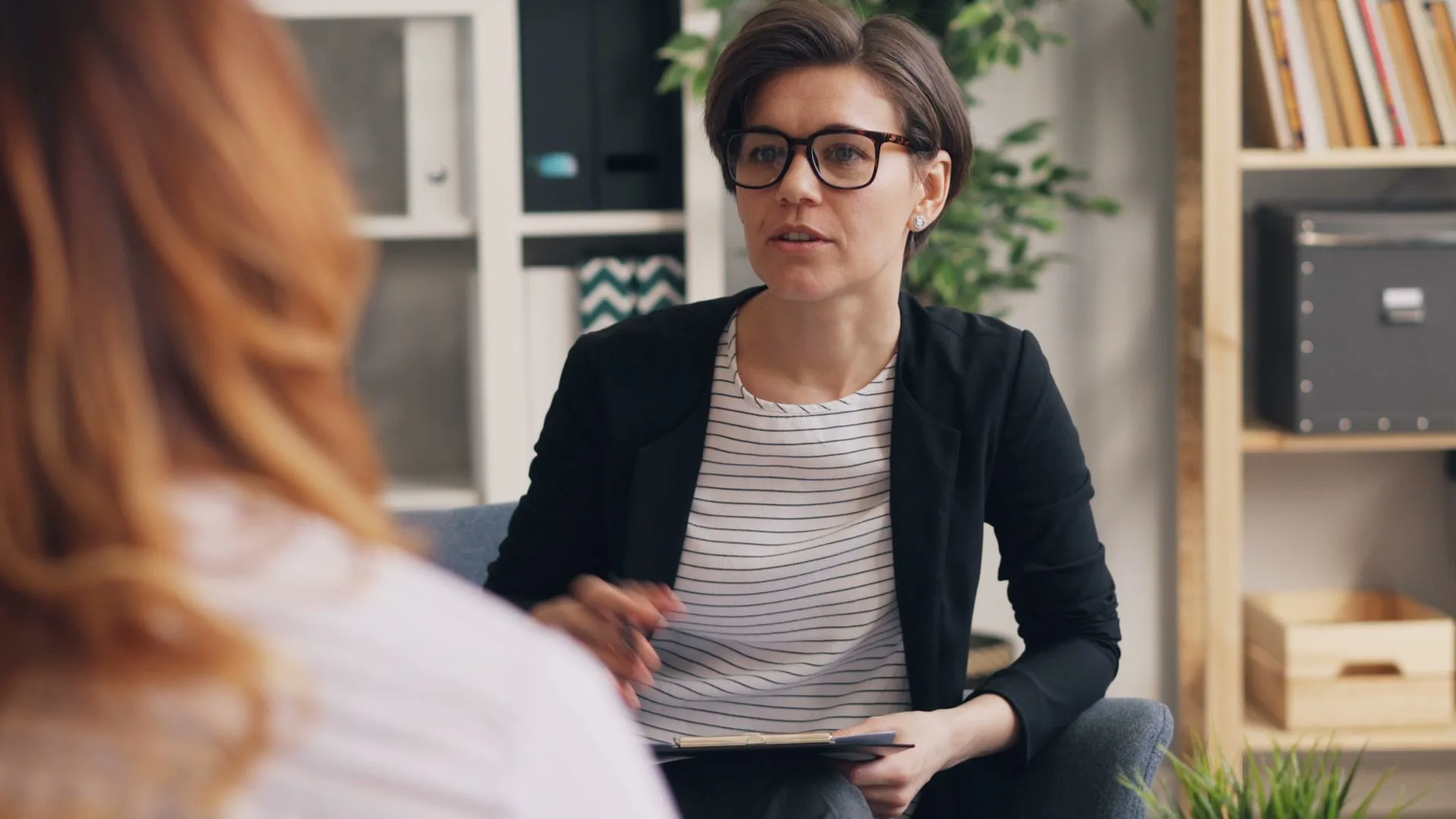 A counsellor speaks to their client.