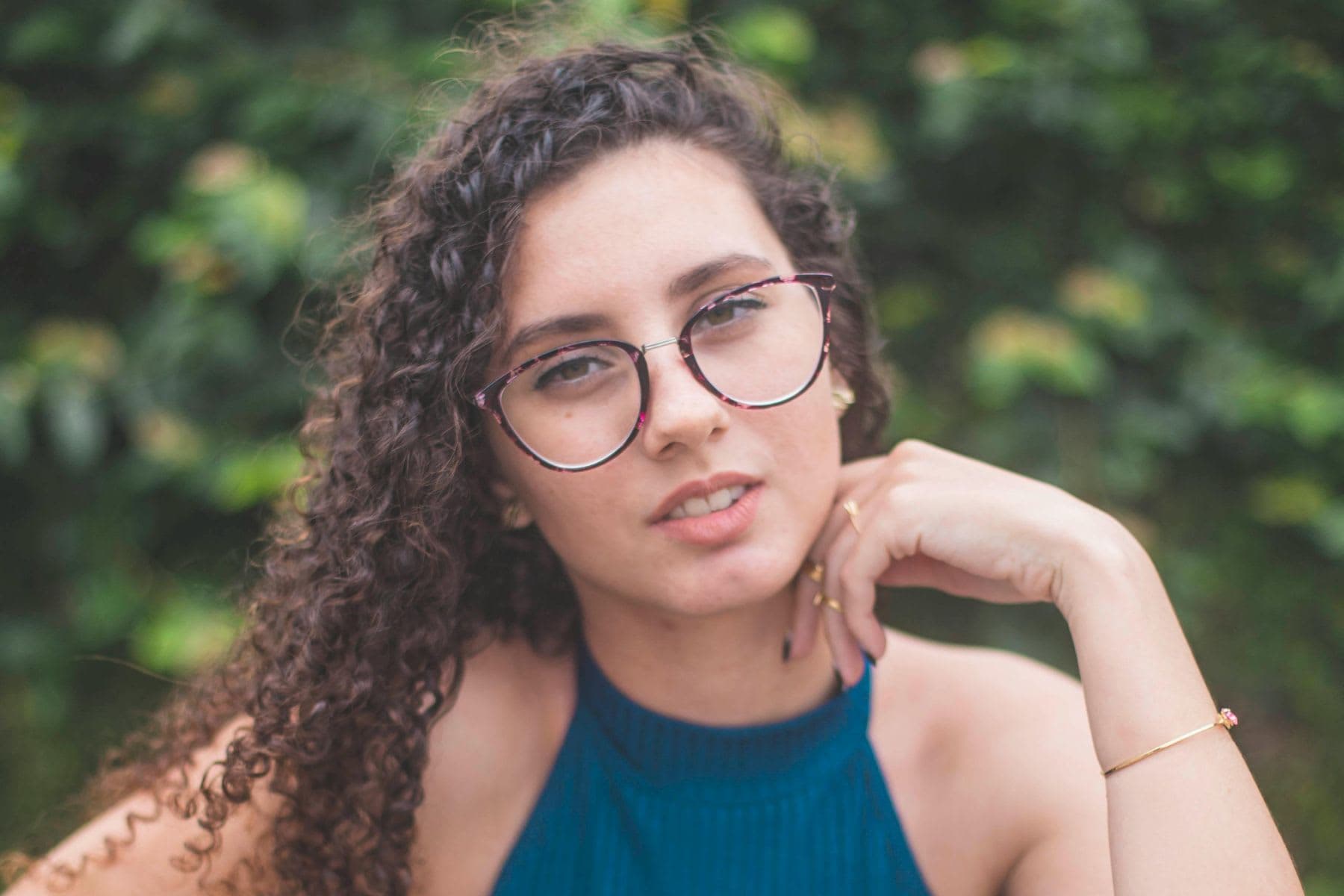 A young woman with glasses