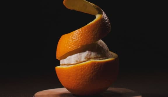 An orange being peeled