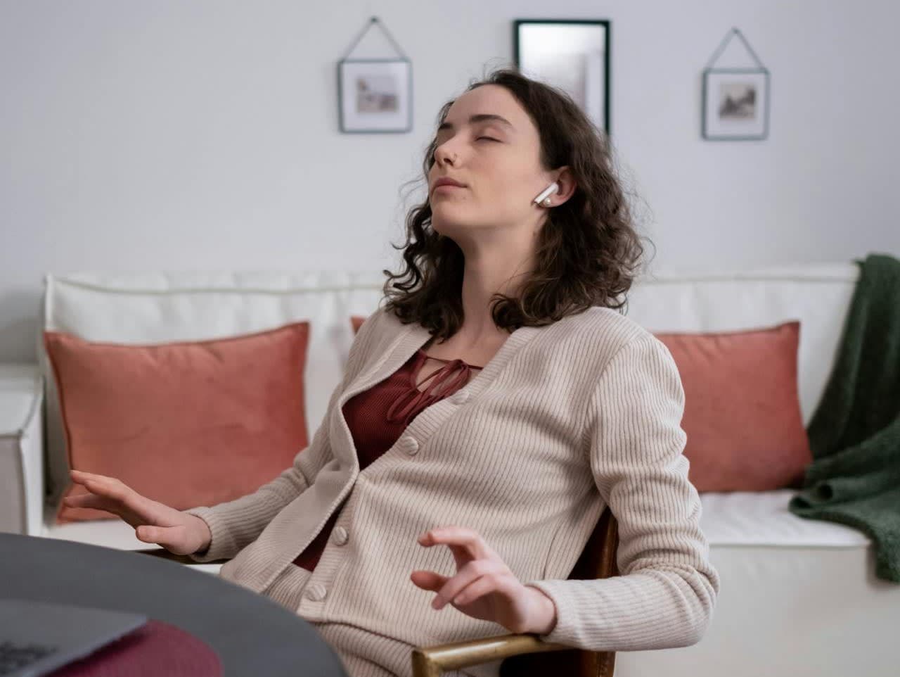 A woman listens to music