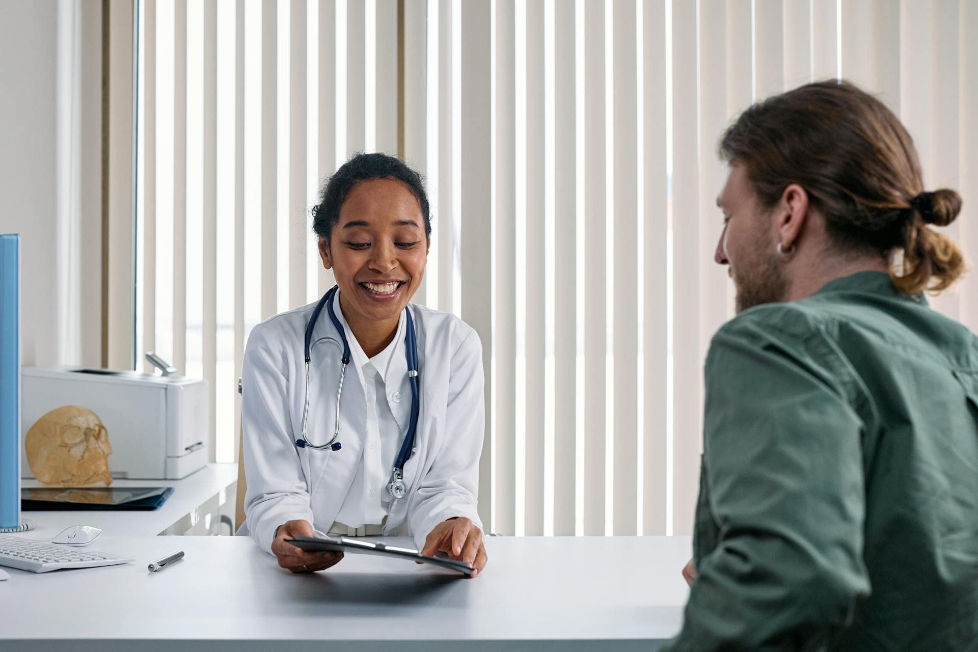 A female doctor talking to a patient